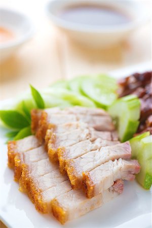 pig roast - Siu Yuk or crispy roasted belly pork Chinese style and roast duck, served with steamed rice. Malaysia Chinese cuisines. Stock Photo - Budget Royalty-Free & Subscription, Code: 400-06928967