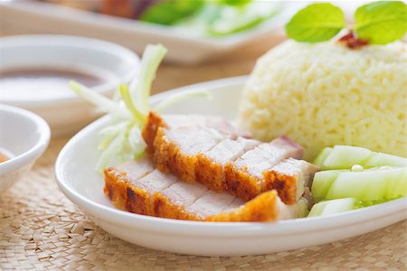 pig roast - Siu Yuk or crispy roasted belly pork Chinese style, served with steamed rice. Singapore Chinese cuisines. Stock Photo - Budget Royalty-Free & Subscription, Code: 400-06928963