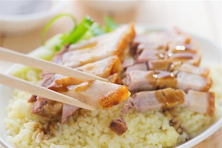 pig roast - Siu Yuk - Chinese roasted pork served with soy and hoisin sauce. Hong Kong cuisine. Close up on meat and chopsticks. Stock Photo - Budget Royalty-Free & Subscription, Code: 400-06928974