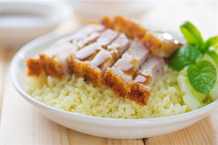 pig roast - Siu Yuk - Chinese crispy roasted belly pork rice. Hong Kong cuisine. Stock Photo - Budget Royalty-Free & Subscription, Code: 400-06928973