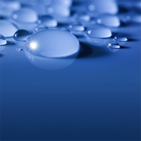 Blue Big Water Drops Background with Sparks  /  focus on the center Photographie de stock - Aubaine LD & Abonnement, Code: 400-06929048