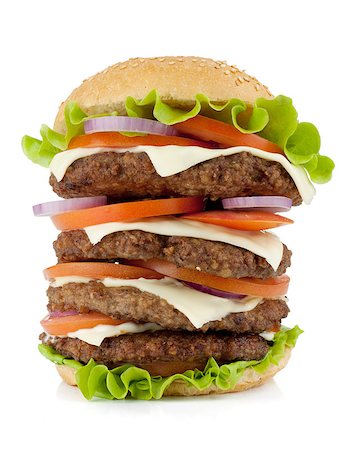 Very large burger with beef, cheese, onion and tomatoes. Isolated on white background Stock Photo - Budget Royalty-Free & Subscription, Code: 400-06920086