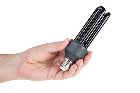 Black (UV) fluorescent lamp with e27 base in hand on the white background Stock Photo - Budget Royalty-Free & Subscription, Code: 400-06921693