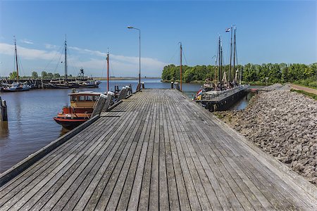 simsearch:400-04484889,k - Wooden jetty in the harbor of Zoutkamp Stock Photo - Budget Royalty-Free & Subscription, Code: 400-06921738