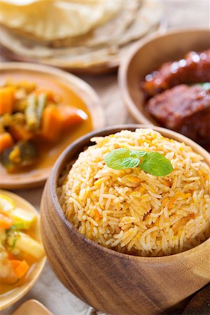 simsearch:400-08075728,k - Biryani rice or pilaf rice with curry, fresh cooked basmati rice with spices, delicious Indian food. Photographie de stock - Aubaine LD & Abonnement, Code: 400-06922060