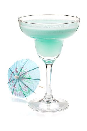 simsearch:400-06915457,k - Blue tropical cocktail in margarita glass and umbrella. Isolated on white Photographie de stock - Aubaine LD & Abonnement, Code: 400-06922353