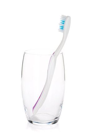 simsearch:400-04552289,k - Toothbrush in a glass. Isolated on white background Foto de stock - Super Valor sin royalties y Suscripción, Código: 400-06922435