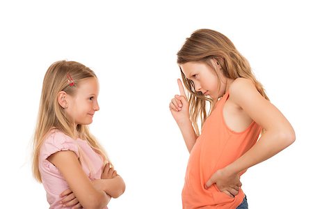 everyday family - Big sister disagree pointing finger at her little sister because she did a silly, foolish, stupid thing or something wrong. Isolated on white background. Stock Photo - Budget Royalty-Free & Subscription, Code: 400-06922849