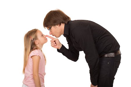 Despairing father pointing the finger and explains what's wrong to her little daughter. Conflict between generations. Isolated on white background. Foto de stock - Super Valor sin royalties y Suscripción, Código: 400-06922851