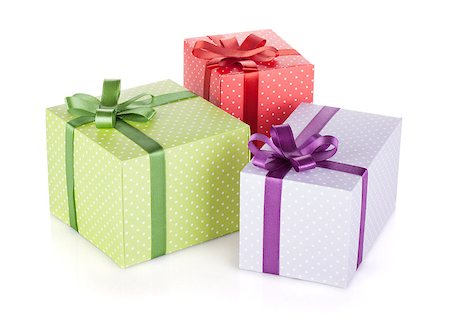 simsearch:400-06360703,k - Three colorful gift boxes with ribbon and bow. Isolated on white background Stockbilder - Microstock & Abonnement, Bildnummer: 400-06923172