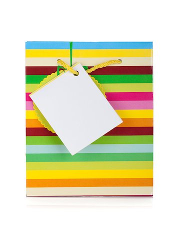 simsearch:400-04231102,k - Colored gift bag. Isolated on white background Photographie de stock - Aubaine LD & Abonnement, Code: 400-06923228