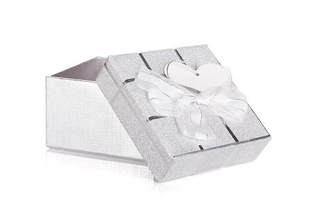 simsearch:400-05674434,k - Silver gift box with bow and heart label. Isolated on white background Stock Photo - Budget Royalty-Free & Subscription, Code: 400-06923338