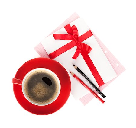 Red coffee cup and love letter with bow. View from above. Isolated on white background Stock Photo - Budget Royalty-Free & Subscription, Code: 400-06923372