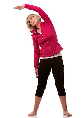 mature woman wearing fitness outfit on white isolated background Stock Photo - Budget Royalty-Free & Subscription, Code: 400-06923641