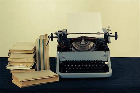 Old typewriter with paper and books, retro colors on the desk Stock Photo - Budget Royalty-Free & Subscription, Code: 400-06923650