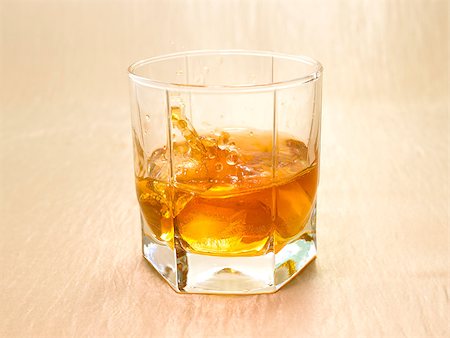 simsearch:400-03979160,k - Glass beaker of cold whisky with ice Stock Photo - Budget Royalty-Free & Subscription, Code: 400-06923738