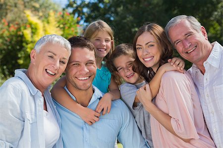 simsearch:693-03304775,k - Smiling family and grandparents in the countryside embracing and smiling at camera Stock Photo - Budget Royalty-Free & Subscription, Code: 400-06934100