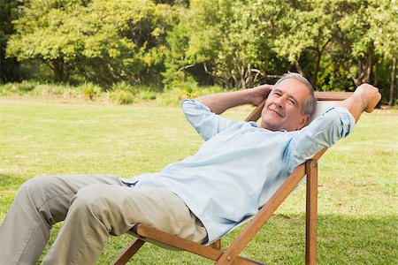 deckchair senior man - Happy mature man sitting on sun lounger and relaxing in park Stock Photo - Budget Royalty-Free & Subscription, Code: 400-06934180