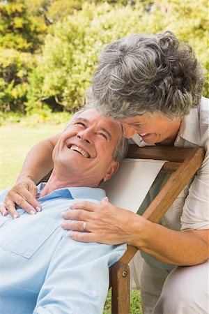 deckchair senior man - Happy mature woman smiling and embracing her husband on a deck chair Stock Photo - Budget Royalty-Free & Subscription, Code: 400-06934194