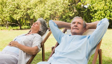 deckchair senior man - Relaxing mature couple sitting on sun loungers in the park in sunshine Stock Photo - Budget Royalty-Free & Subscription, Code: 400-06934197