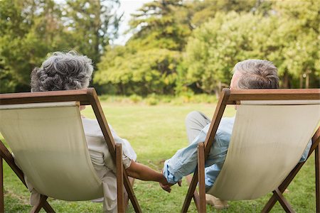 deckchair senior man - Happy mature couple sitting on sun loungers and holding hands Stock Photo - Budget Royalty-Free & Subscription, Code: 400-06934200