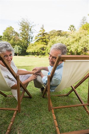 deckchair senior man - Smiling mature couple lying on sun loungers and looking at camera Stock Photo - Budget Royalty-Free & Subscription, Code: 400-06934203