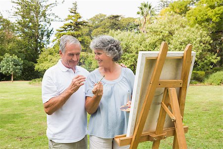 Smiling retired woman painting on canvas with husband and talking in the park Stock Photo - Budget Royalty-Free & Subscription, Code: 400-06934233