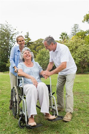 simsearch:6109-06684838,k - Retired woman in wheelchair with husband and daughter laughing in the park Foto de stock - Super Valor sin royalties y Suscripción, Código: 400-06934261