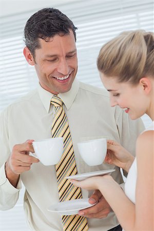 Stylish workmates drinking coffee together in break room Stock Photo - Budget Royalty-Free & Subscription, Code: 400-06934569