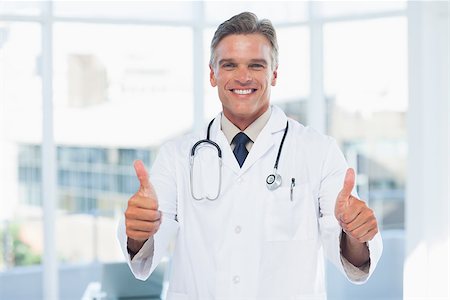 Experienced doctor posing thumbs up in medical office Stock Photo - Budget Royalty-Free & Subscription, Code: 400-06934657