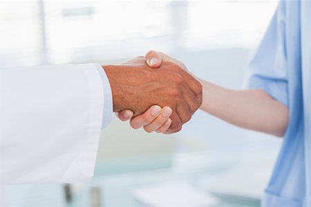pictures of two nurses shaking hands - Hands of a doctor and nurse shaking hands in medical office Stock Photo - Budget Royalty-Free & Subscription, Code: 400-06930507