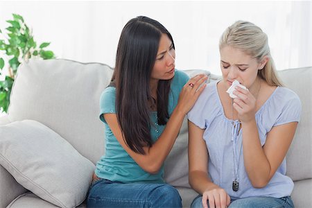 simsearch:400-07059986,k - Concerned woman comforting her crying friend at home on the couch Stock Photo - Budget Royalty-Free & Subscription, Code: 400-06930765