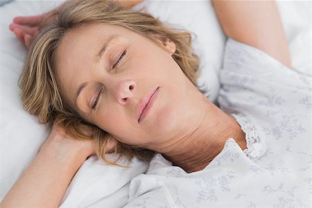 simsearch:400-06891126,k - Woman sleeping peacefully in bed close up in bedroom at home Stock Photo - Budget Royalty-Free & Subscription, Code: 400-06931221