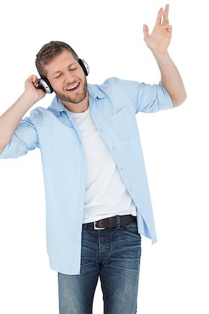 simsearch:400-06690896,k - Cool trendy model on white background listening to music and singing Stock Photo - Budget Royalty-Free & Subscription, Code: 400-06931728