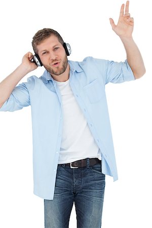 simsearch:400-06690896,k - Trendy model listening to music and singing on white background Stock Photo - Budget Royalty-Free & Subscription, Code: 400-06931729