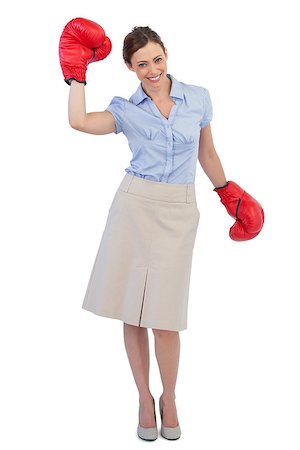 picture of women wearing boxing - Happy businesswoman posing with red boxing gloves against white background Stock Photo - Budget Royalty-Free & Subscription, Code: 400-06932086