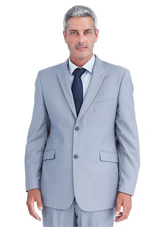 simsearch:649-05658209,k - Serious confident businessman posing against white background Stock Photo - Budget Royalty-Free & Subscription, Code: 400-06932138