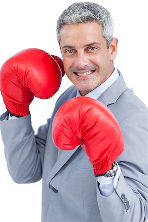 simsearch:649-05658209,k - Happy businessman with boxing gloves on white background Stock Photo - Budget Royalty-Free & Subscription, Code: 400-06932192