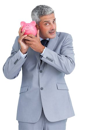 simsearch:400-05715051,k - Curious businessman on white background holding piggy bank Fotografie stock - Microstock e Abbonamento, Codice: 400-06932207