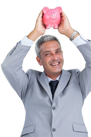 simsearch:400-05715051,k - Cheerful businessman on white background holding piggy bank above his head Fotografie stock - Microstock e Abbonamento, Codice: 400-06932214