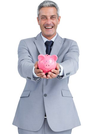 simsearch:400-05715051,k - Wide smiling businessman on white background holding piggy bank Fotografie stock - Microstock e Abbonamento, Codice: 400-06932212