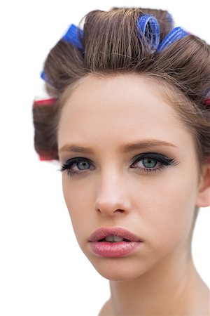 Pretty young model with hair curlers in close up on white background Stock Photo - Budget Royalty-Free & Subscription, Code: 400-06932405