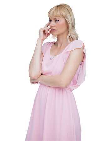 fresh-faced - Thoughtful blonde woman touching her forehead against white background Stock Photo - Budget Royalty-Free & Subscription, Code: 400-06932542
