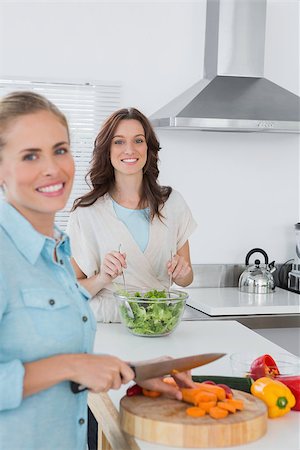 Relaxed women cooking together in the kitchen Stock Photo - Budget Royalty-Free & Subscription, Code: 400-06932728