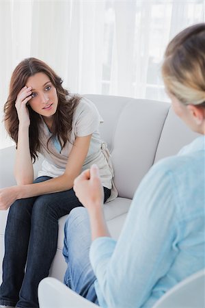 Upset woman sitting with her therapist talking to her and advising her Stock Photo - Budget Royalty-Free & Subscription, Code: 400-06932739