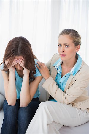 simsearch:400-04124768,k - Crying woman with her therapist on couch at office Stock Photo - Budget Royalty-Free & Subscription, Code: 400-06932771