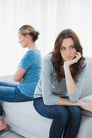 simsearch:6109-07497144,k - Angry women after a tiff not speaking sitting on the sofa Stock Photo - Budget Royalty-Free & Subscription, Code: 400-06932792