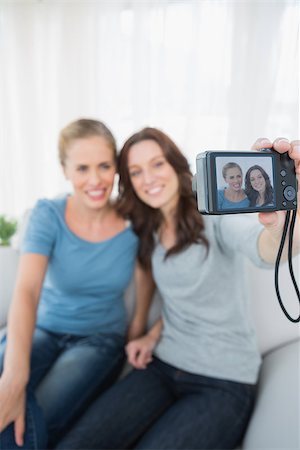 simsearch:400-07059986,k - Cheerful friends taking pictures of themselves at home Stock Photo - Budget Royalty-Free & Subscription, Code: 400-06932846