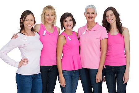 simsearch:400-06932887,k - Women wearing pink for breast cancer awareness on white background Fotografie stock - Microstock e Abbonamento, Codice: 400-06932868