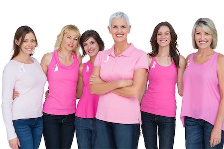 simsearch:400-06932882,k - Enthusiastic women posing with pink tops for breast cancer on white background Stock Photo - Budget Royalty-Free & Subscription, Code: 400-06932874